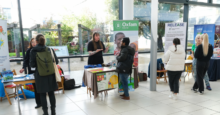 Students talking to community organisations at their stands during the UCD Volunteer Fair.